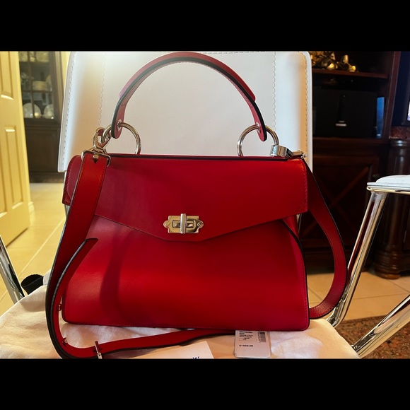 Proenza SchoulerDepth:4.75"
Strap 20"
Width:12.5"
Handle Drop:5.25"
Height:9.75” - Picture 2 of 10